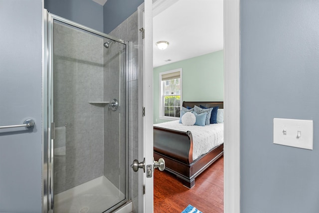 129 Roosevelt Dr, Wood-Ridge, NJ 07075 - bathroom with wood finished floors and a stall shower
