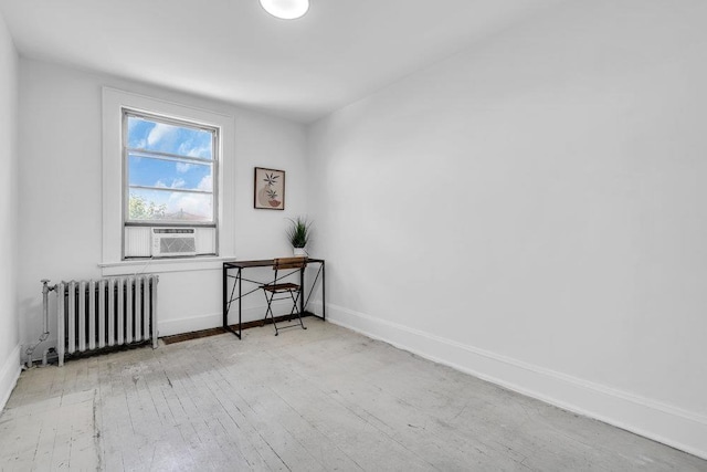 110 56th St, West New York, NJ 07093 - unfurnished room with radiator heating unit, cooling unit, hardwood / wood-style floors, and baseboards