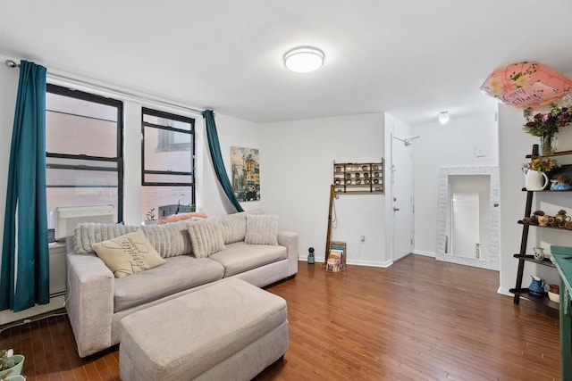 living room with a baseboard radiator and dark hardwood / wood-style flooring