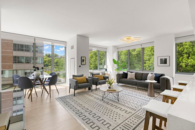 9 Ave At Port Imperial # 524, West New York, NJ 07093 - living room featuring wood finished floors and expansive windows