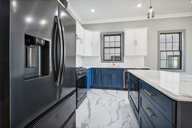 kitchen featuring stainless steel refrigerator with ice dispenser, blue cabinets, black range with gas cooktop, sink, and white cabinetry