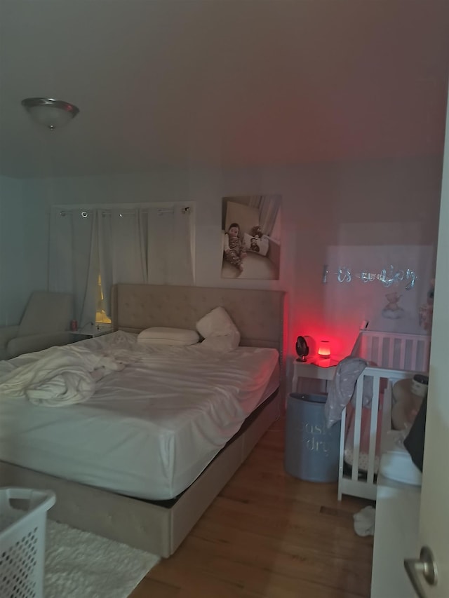 bedroom featuring wood finished floors