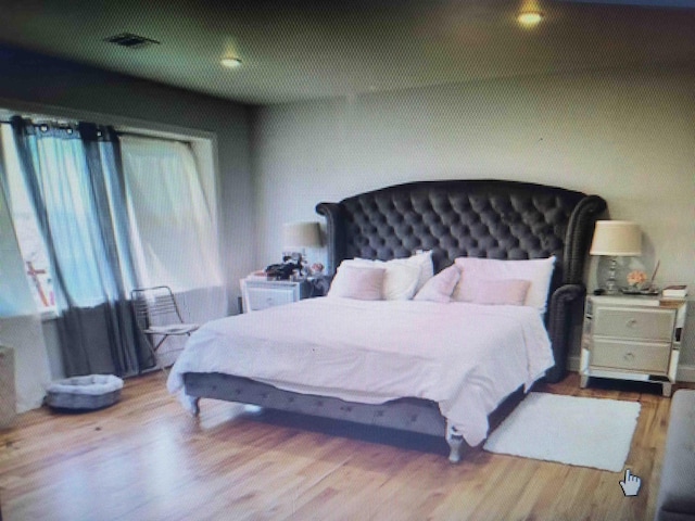 bedroom featuring wood finished floors