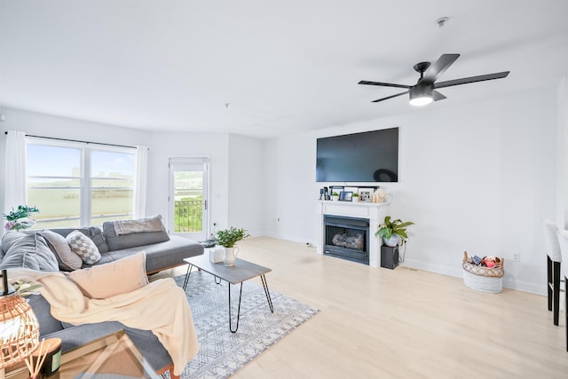 319 The Promenade, Edgewater, NJ 07020 - living room featuring wood finished floors, a fireplace, and ceiling fan