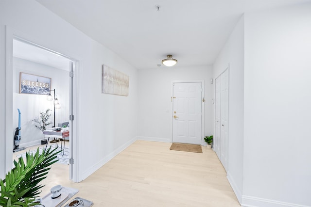319 The Promenade, Edgewater, NJ 07020 - hallway featuring light wood-style flooring and baseboards