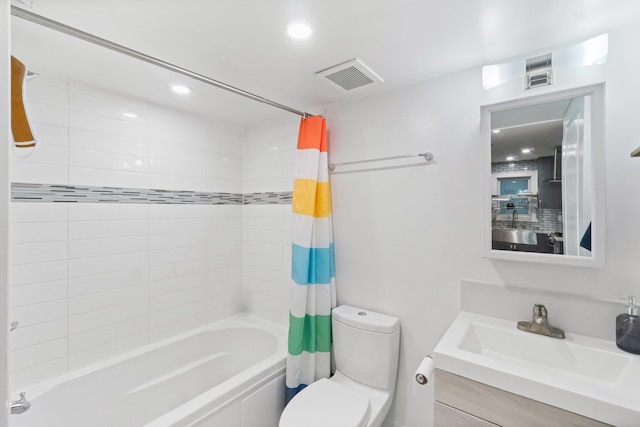 full bathroom featuring vanity, shower / tub combo, and toilet