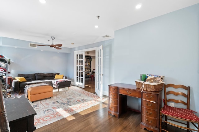 living room with french doors, ceiling fan, and wood-type flooring