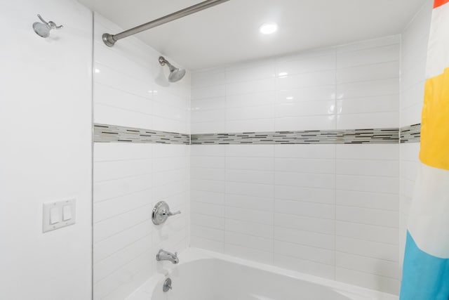 bathroom with shower / bath combo with shower curtain