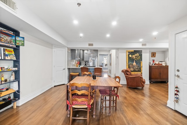 dining space featuring light hardwood / wood-style flooring