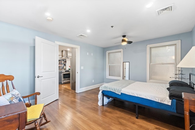 bedroom with hardwood / wood-style floors