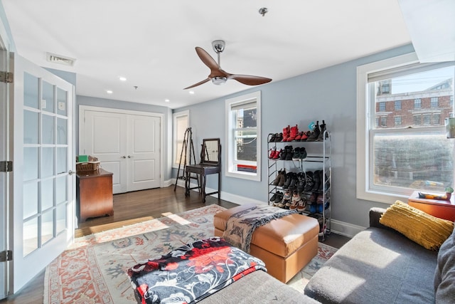 living room with ceiling fan, hardwood / wood-style floors, and a wealth of natural light