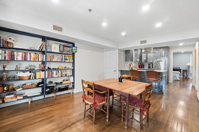 dining room with hardwood / wood-style flooring