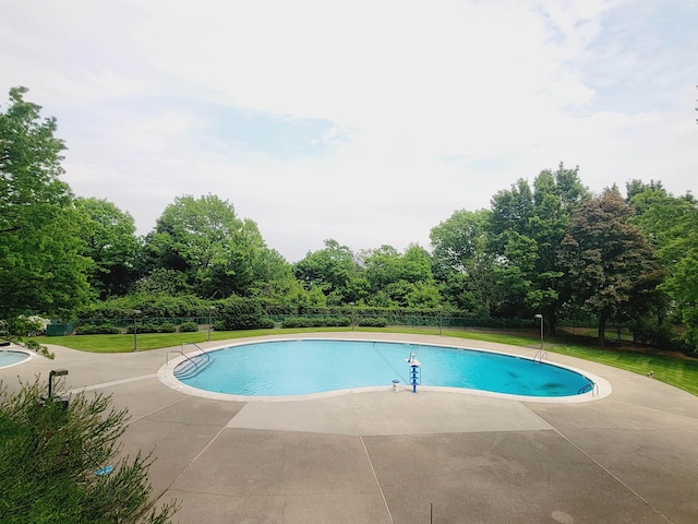 view of pool featuring a patio and a fenced in pool