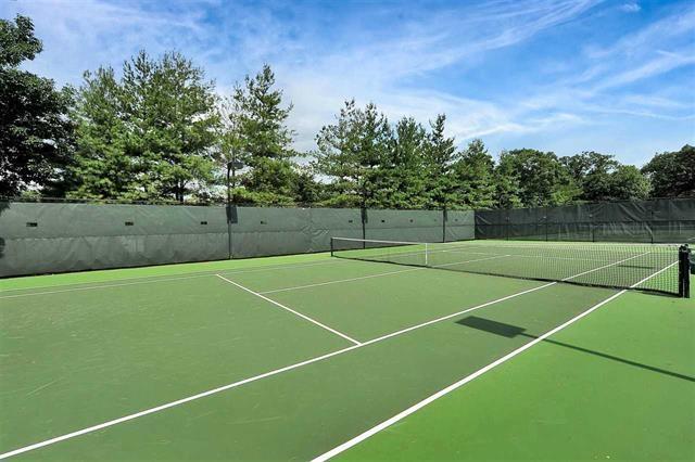 view of sport court featuring fence and community basketball court