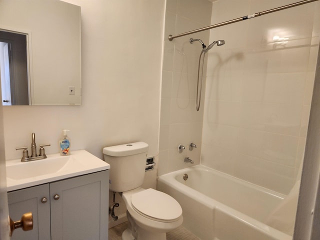 bathroom featuring toilet, vanity, and shower / bath combination
