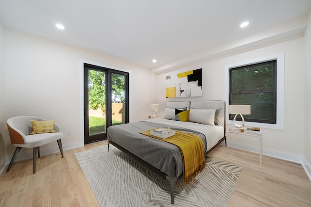 247 Harrison Ave Unit 1, Jersey City, NJ 07304 - bedroom with access to outside, light wood-style floors, and recessed lighting