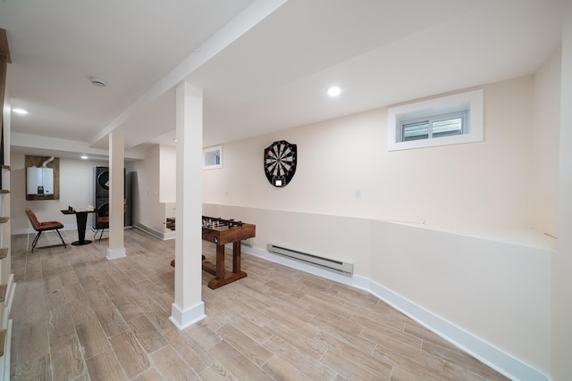 247 Harrison Ave Unit 1, Jersey City, NJ 07304 - below grade area with baseboard heating, light wood-style flooring, and recessed lighting