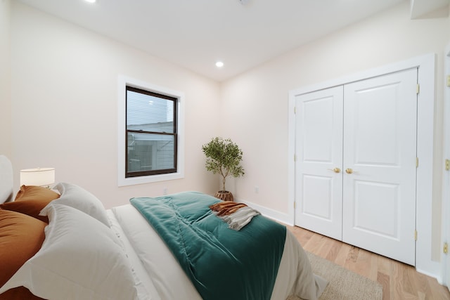 247 Harrison Ave Unit 1, Jersey City, NJ 07304 - bedroom featuring light wood-type flooring, recessed lighting, and a closet