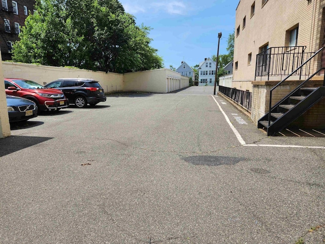 86 W 33rd St Unit 207, Bayonne, NJ 07002 - uncovered parking lot featuring stairs and a residential view
