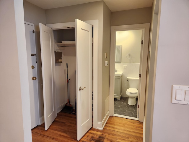 86 W 33rd St Unit 207, Bayonne, NJ 07002 - hallway featuring light wood-style flooring and a sink