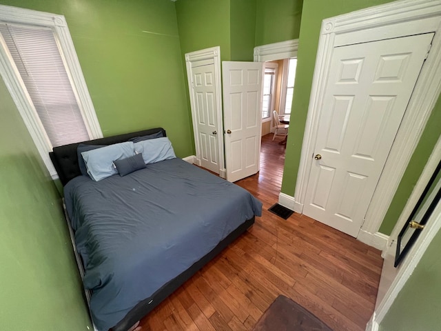 bedroom featuring dark hardwood / wood-style flooring