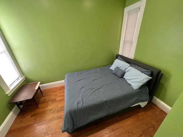 bedroom with wood-type flooring