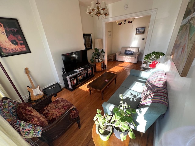 living room featuring a chandelier and hardwood / wood-style floors