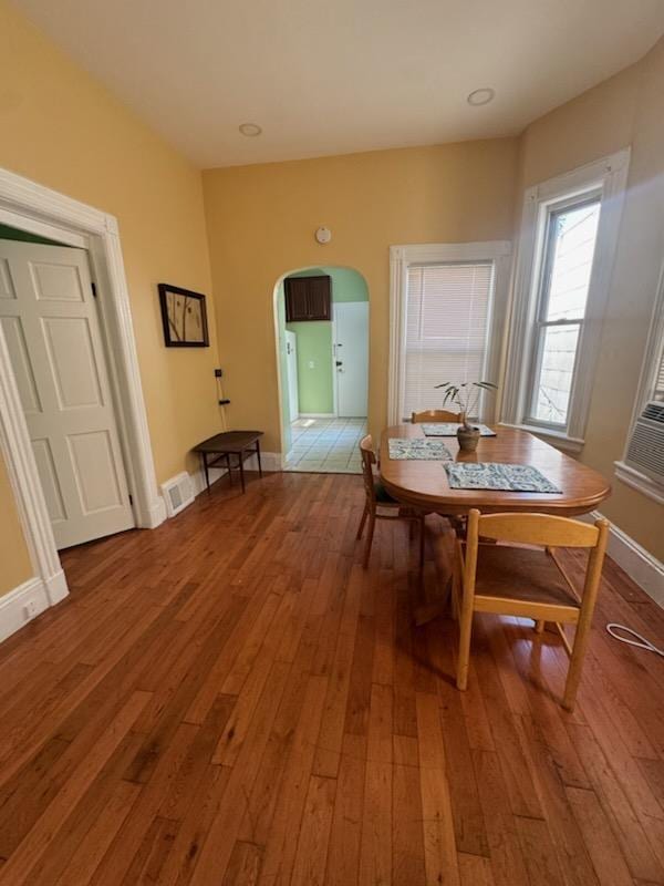 dining area with hardwood / wood-style flooring