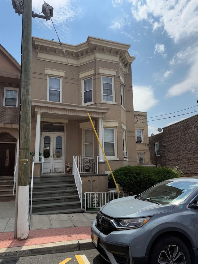 811 Sip St, Union City, NJ 07087 - italianate house featuring a porch and stucco siding