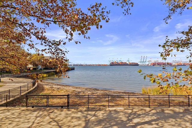 view of water feature with fence