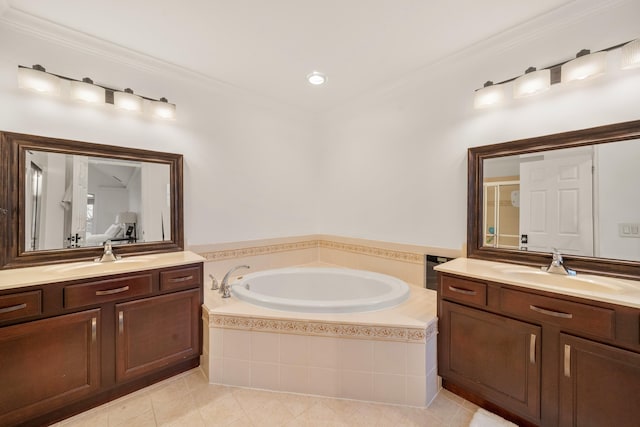 full bathroom with two vanities, a sink, and a bath