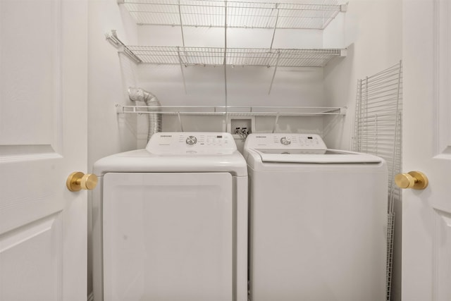 clothes washing area with laundry area and washing machine and clothes dryer