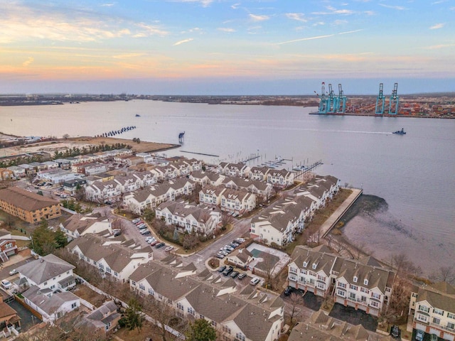 bird's eye view featuring a water view and a residential view