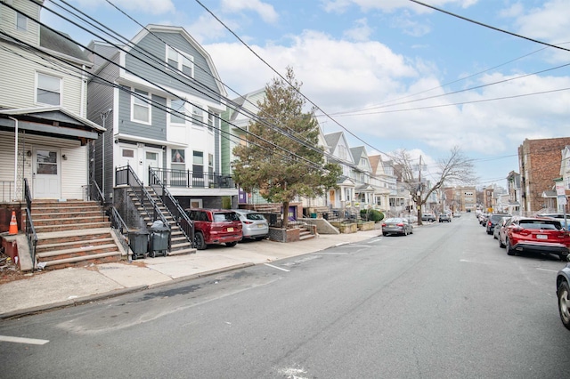 view of road with curbs and sidewalks