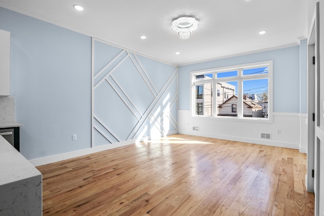 20 Zabriskie St Unit 2, Jersey City, NJ 07037 - unfurnished living room featuring crown molding, recessed lighting, light wood-type flooring, and visible vents