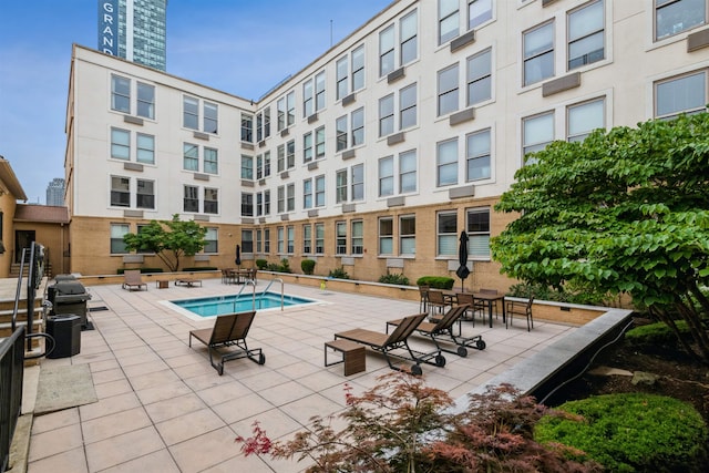 view of pool featuring a patio area