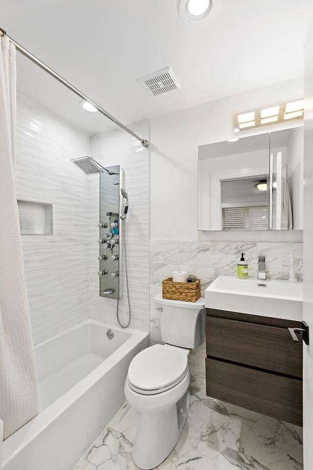 121 Coles St Unit 1, Jersey City, NJ 07306 - full bathroom with shower / bath combo, toilet, tile walls, marble look tile flooring, and vanity