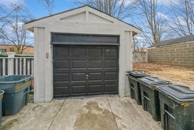 158 W 8th St, Bayonne, NJ 07002 - detached garage featuring concrete driveway and fence