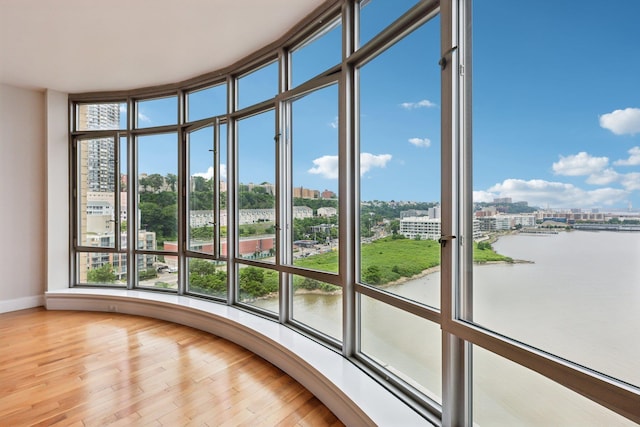 8100 River Rd Unit 1215, North Bergen, NJ 07047 - unfurnished sunroom featuring a city view, a water view, and plenty of natural light