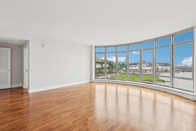 8100 River Rd Unit 1215, North Bergen, NJ 07047 - unfurnished room featuring wood finished floors, a city view, and floor to ceiling windows