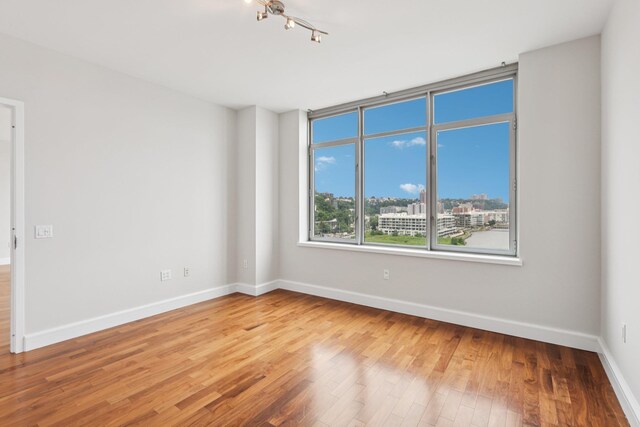 8100 River Rd Unit 1215, North Bergen, NJ 07047 - empty room featuring wood finished floors and baseboards