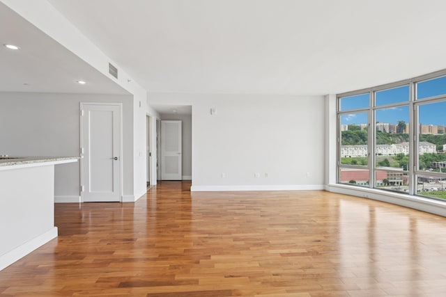 8100 River Rd Unit 1215, North Bergen, NJ 07047 - spare room featuring light wood finished floors, recessed lighting, and a city view