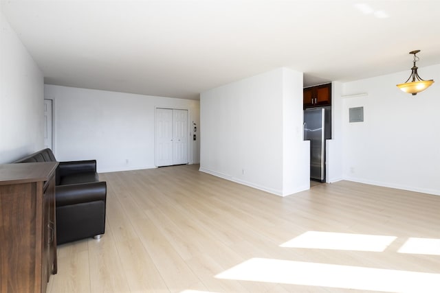500 Central Ave Unit 520, Union City, NJ 07087 - unfurnished living room with light wood finished floors and baseboards