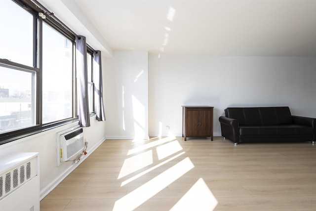 500 Central Ave Unit 520, Union City, NJ 07087 - sitting room with radiator, light wood-style floors, a wealth of natural light, and baseboards