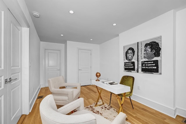 sitting room featuring light hardwood / wood-style flooring