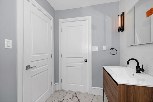 bathroom with vanity and backsplash