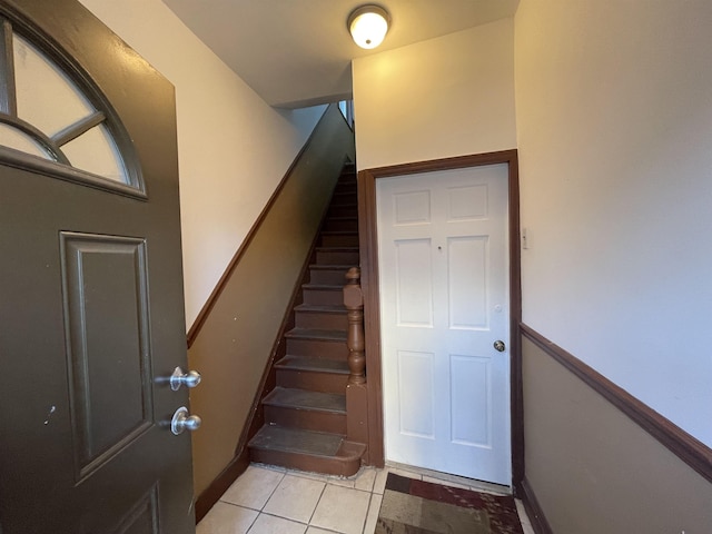 stairway with tile patterned flooring