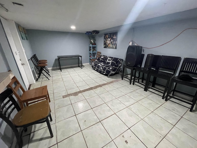 interior space featuring light tile patterned floors, baseboards, and visible vents