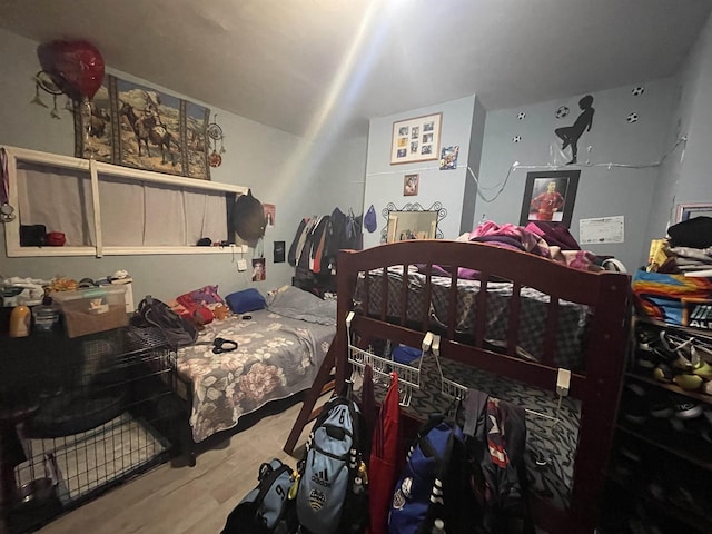 bedroom with wood finished floors