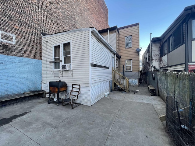 exterior space with fence and entry steps